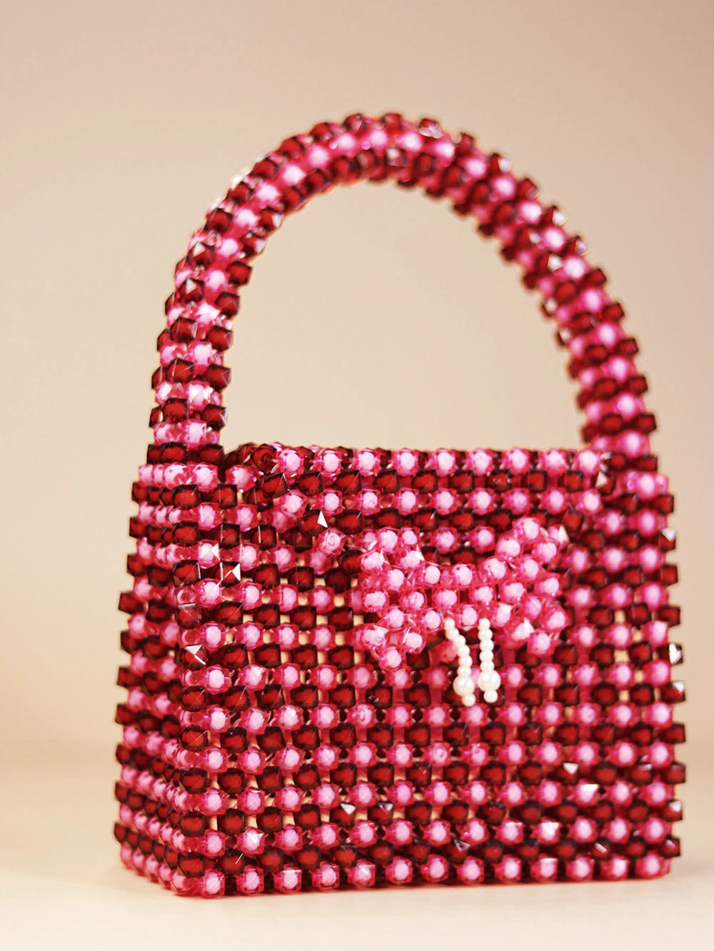 Glossy Pink Beaded Handbag with Charm