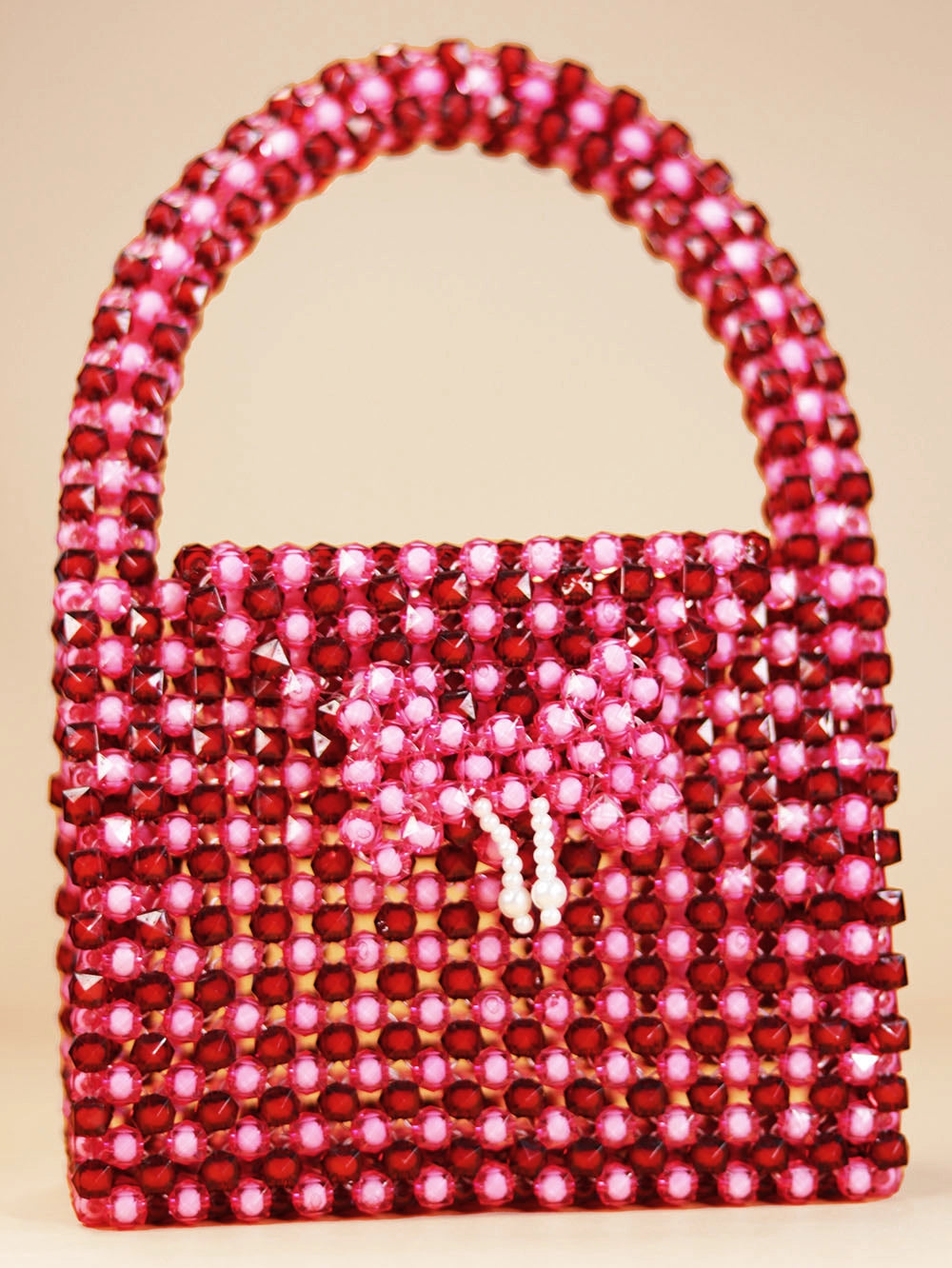 Glossy Pink Beaded Handbag with Charm